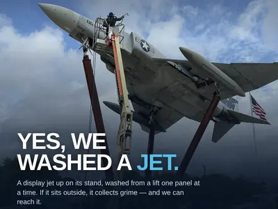 ProWash360 crew washing a display fighter jet from a lift